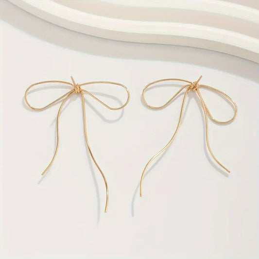 Thin Bow Earrings in Gold